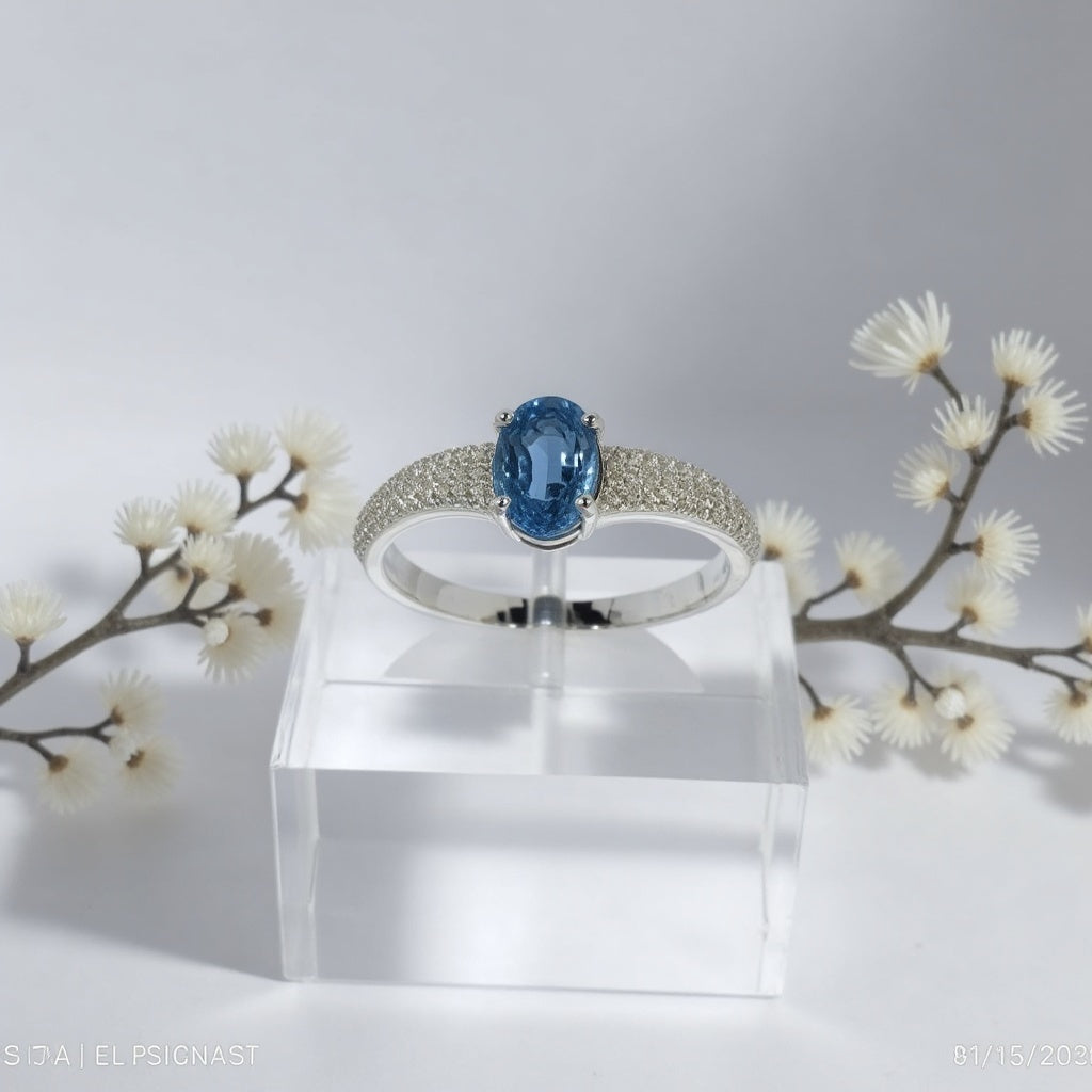 Sterling Silver Ring with Oval Blue Topaz and Cubic Zirconia Accents