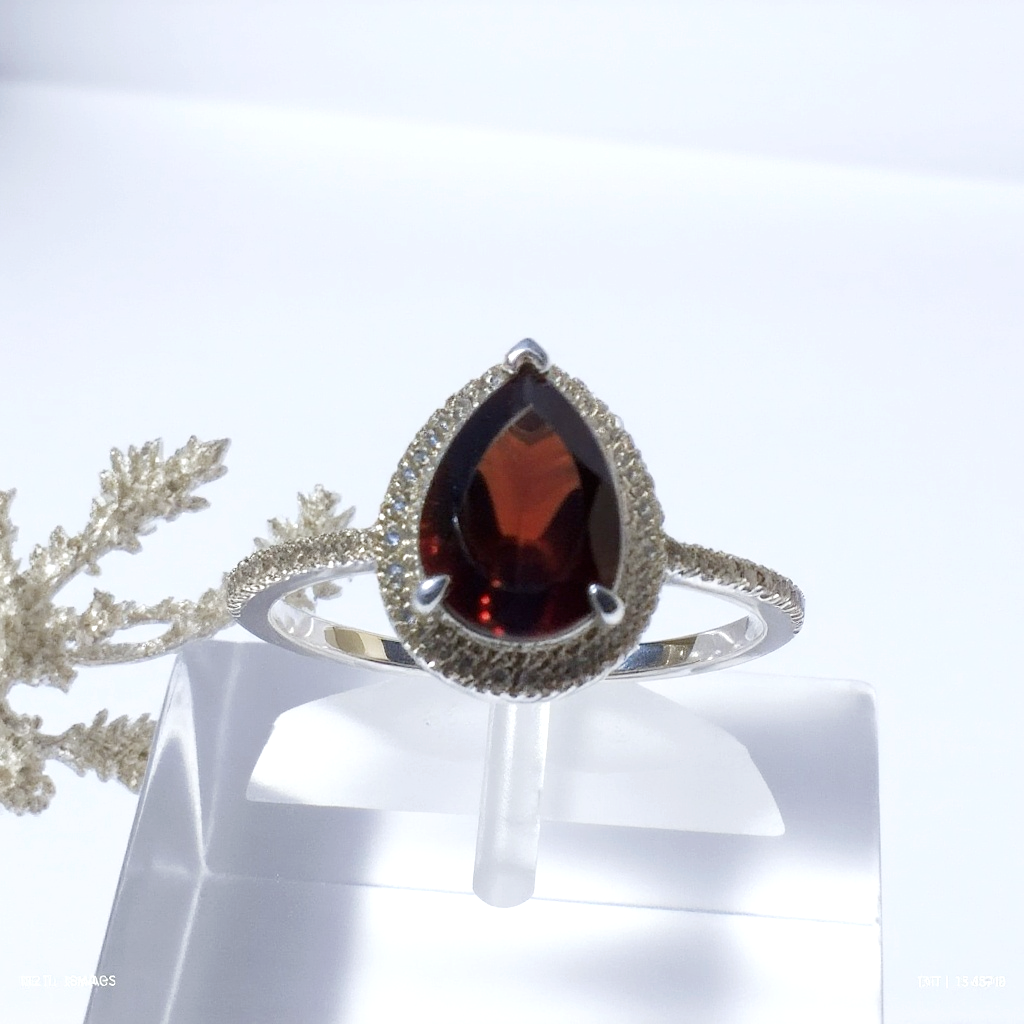 Sterling Silver Ring with Pear-Shaped Garnet and Cubic Zirconia Accents