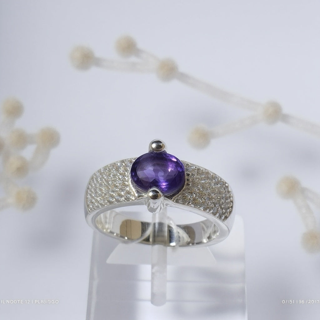 Sterling Silver Ring with Oval Blue Topaz and Cubic Zirconia Accents